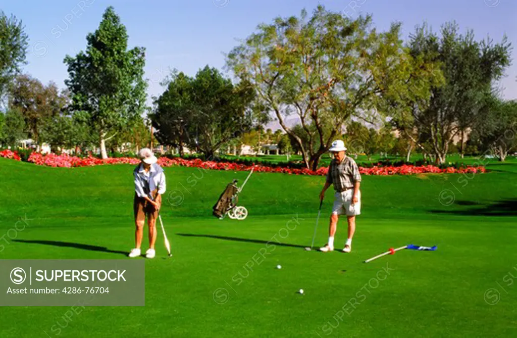 Senior citizens putting on green in Palm Springs California