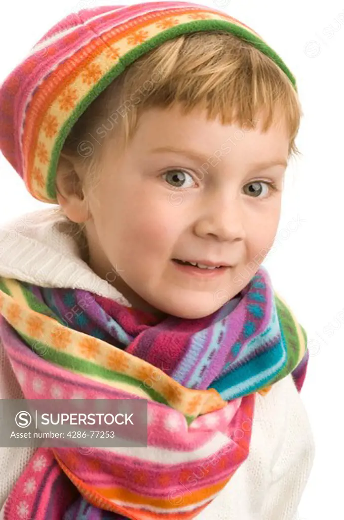 Little girl wearing colorful winter clothes, white background