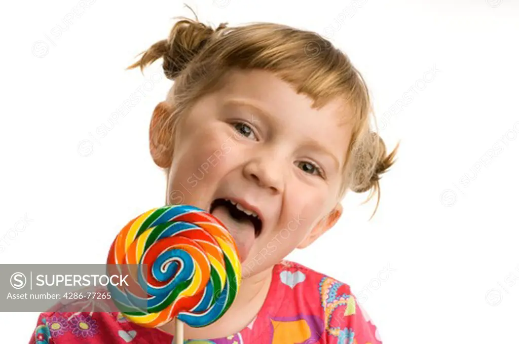 Little girl with lollypop, white background