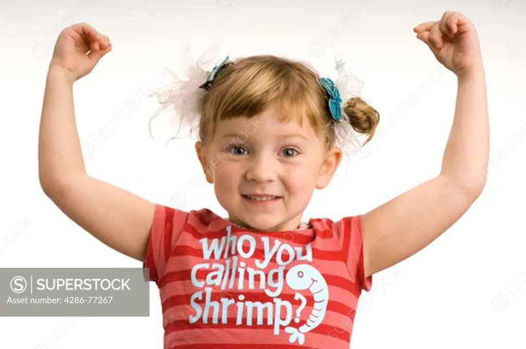 Little girl holding up arms cheering, white background