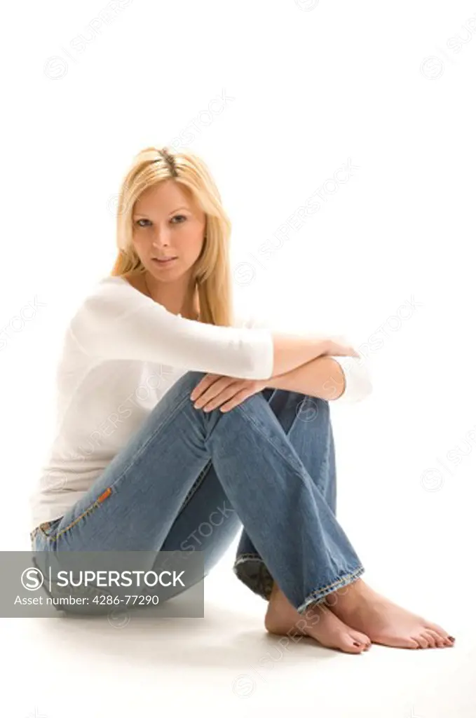 Close-up of an attractive blonde woman in a sitting position