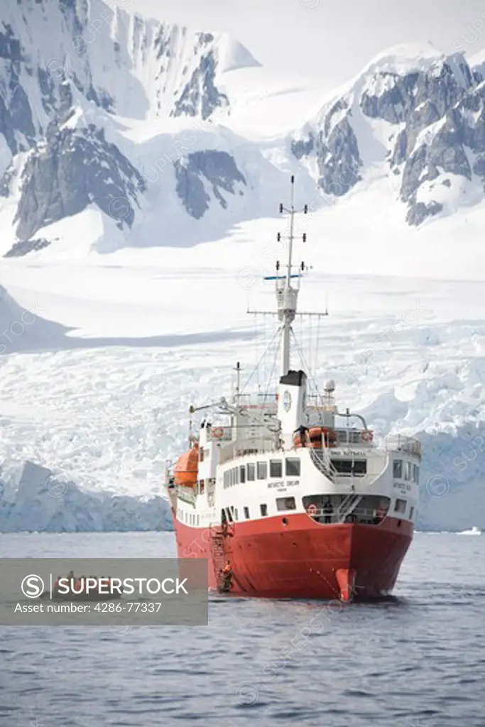 Exploration zodiac approaches expedition ship Antarctic Dream off Petermann Island, Antarctica