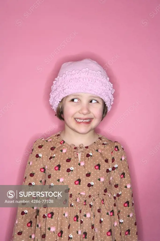 5 year old girl portrait on pink background
