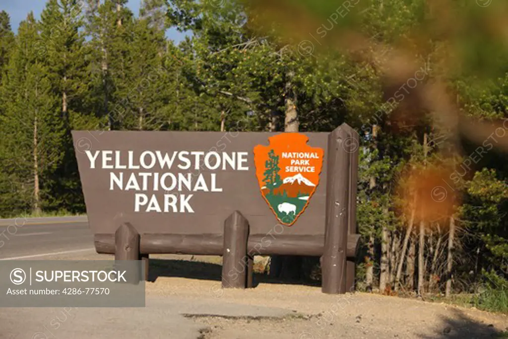 Sign at the west entrance to Yellowstone National Park, West Yellowstone, Idaho, USA