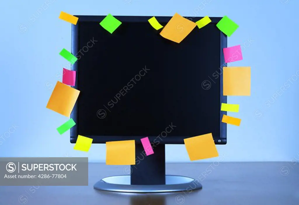 ADHESIVE NOTES ON A COMPUTER.
