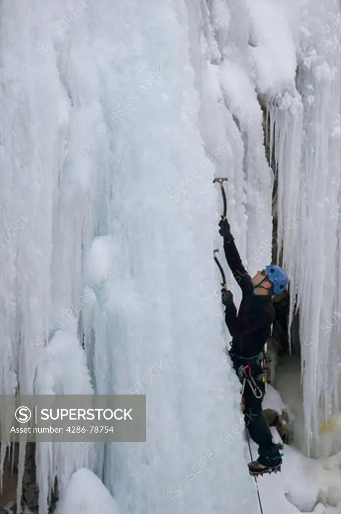 Man ice climbing in Box Canyon, Ouray, Colorado