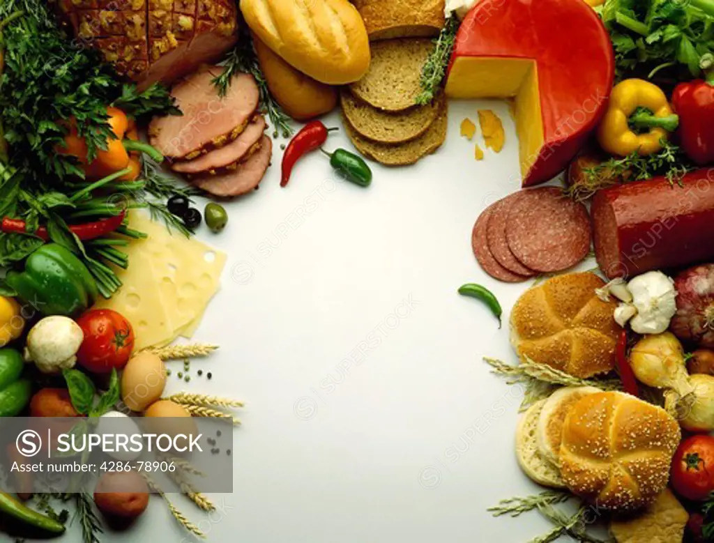 Overhead view of a food spread including cheese and crackers