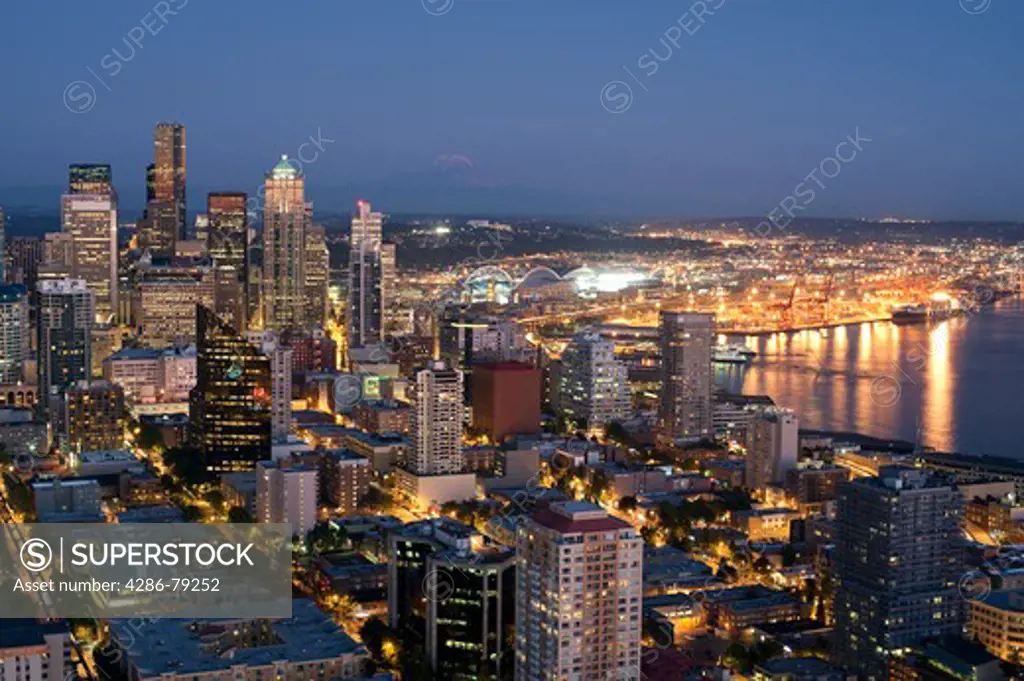 Seattle Skyline from Space Needle with Mount Rainier and downtown building at twilight Seattle Washington State USA