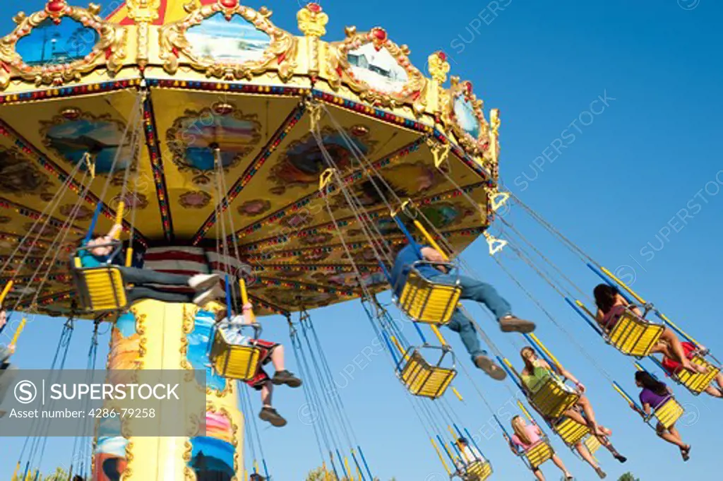 Swing ride with kids enjoying the ride at the Evergreen State Fair Monroe Washingotn State USA
