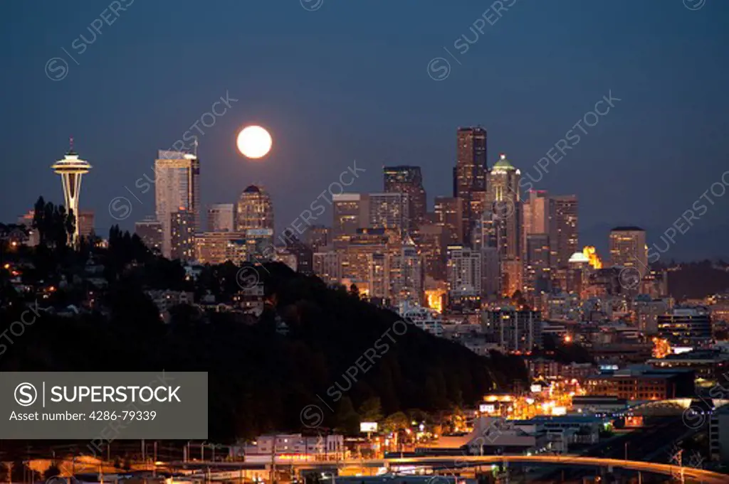 Moonrise from Magnolia Bluff Seattle Skyline at twilight with Space Needle Seattle Washington State USA