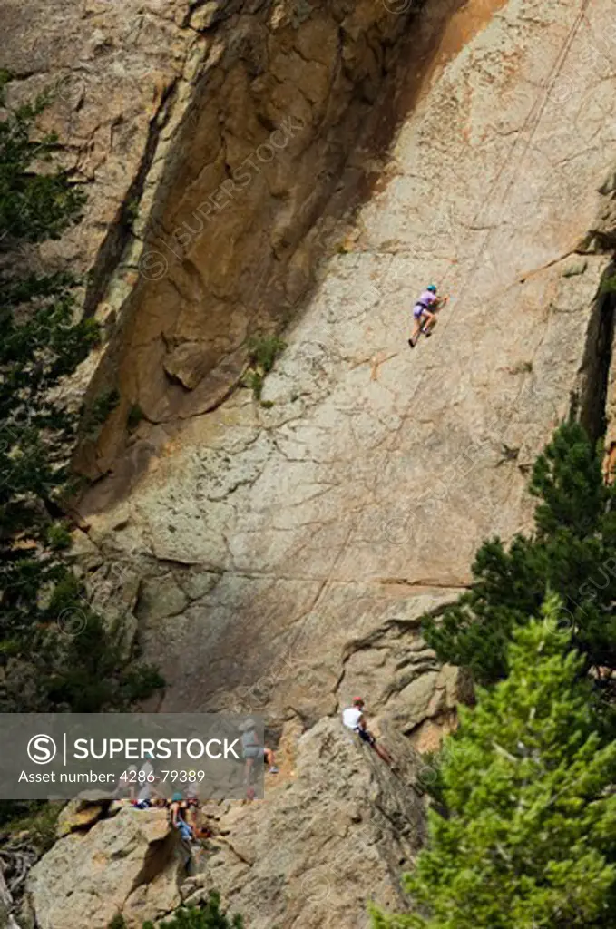 Kids climbing Christmas Rock at Cheley Camp, summer, Estes Park, Colorado, not released