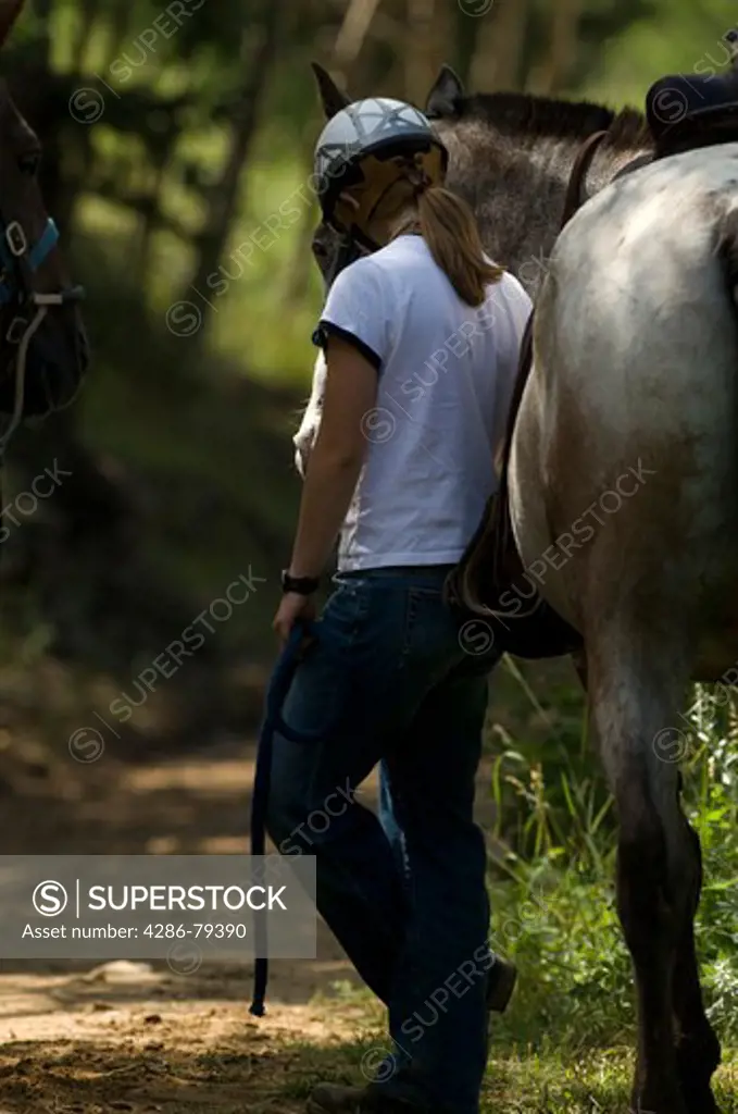 Girl and a horse at Cheley Camp, summer camp, Estes Park, Colorado, USA, not released