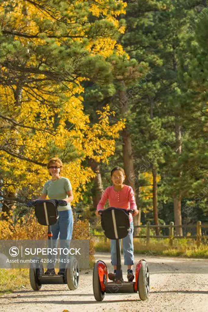 Folks of all ages enjoy the freedom and control of riding Segways through fall colors in Estes Park , Colorado, high in the Rocky Mountains. Segways provided by Segway of Northern Colorado
