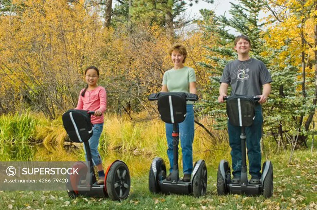 Folks of all ages enjoy the freedom and control of riding Segways through fall colors in Estes Park , Colorado, high in the Rocky Mountains. Segways provided Segway of Northern Colorado