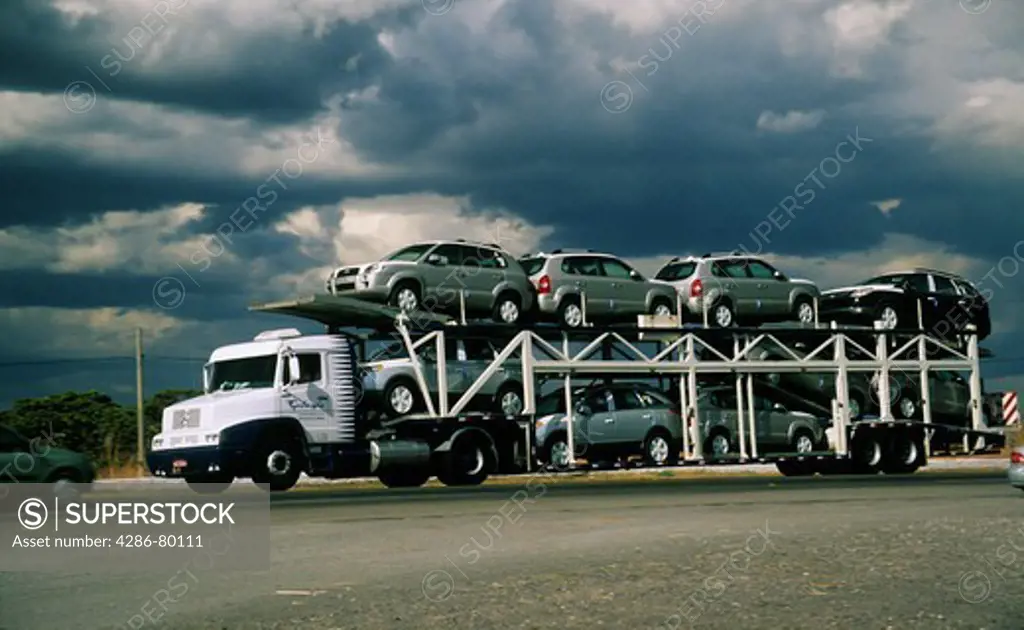 New automobile transportation by truck in Brazil; automobile manufacturing is an important industry in Brazil.