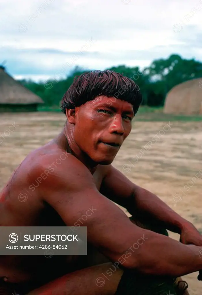 Kamayur tribe wrestler, recovering between bouts, lives in the Upper Xingu region along with the Suya, Kiabi, and Yudja  tribes.