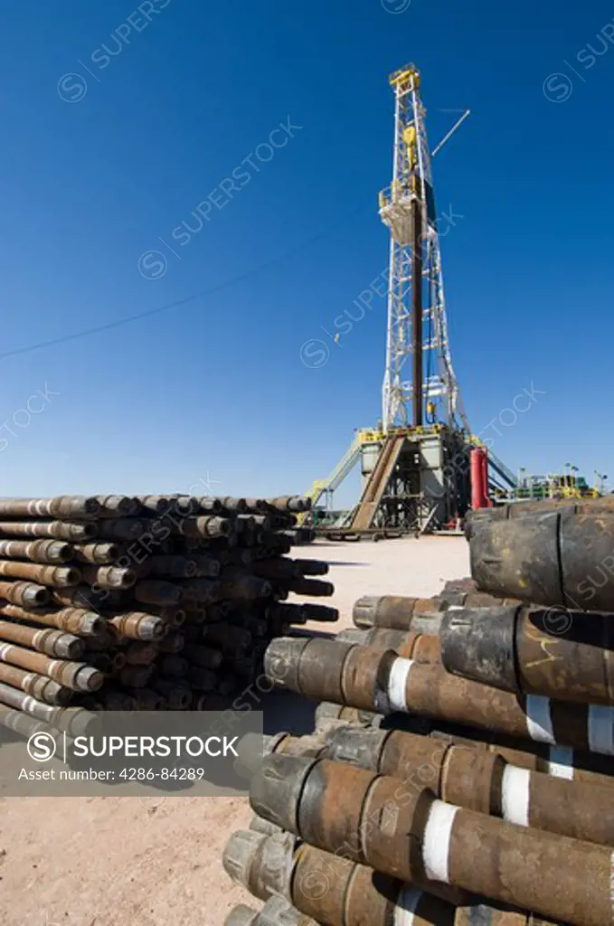 Drill pipe stacked near New Mexico rig.