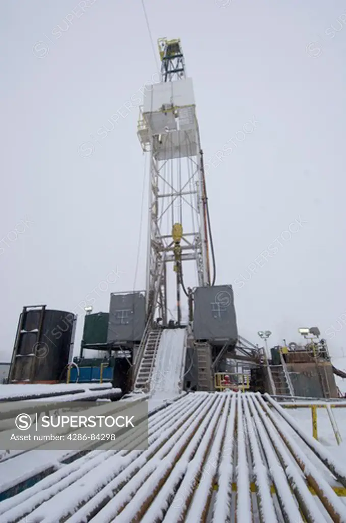 Wyoming drilling derrick during a winter storm.