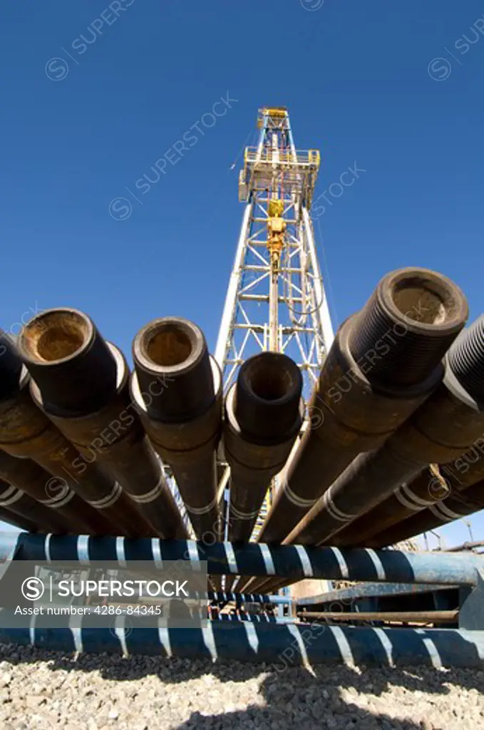 Drill pipe on rack by drilling rig.