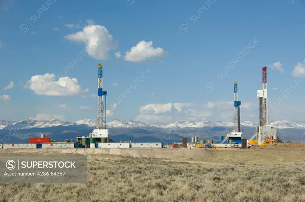 Drilling rigs in Wyoming using the same pad.