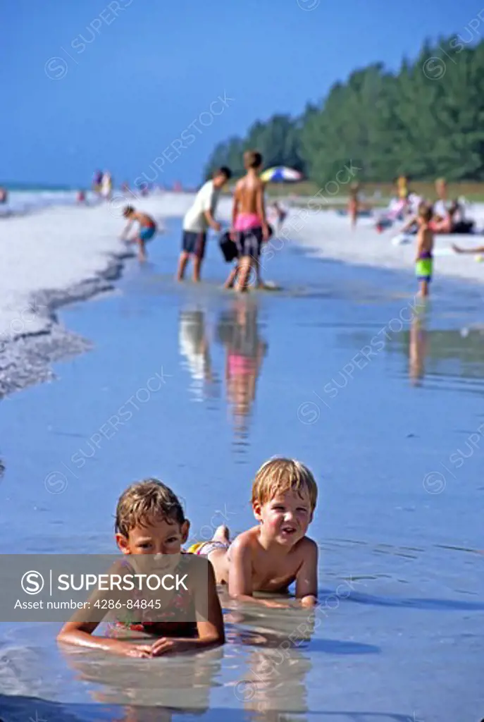 Children playing on beach Sanibel Island Florida