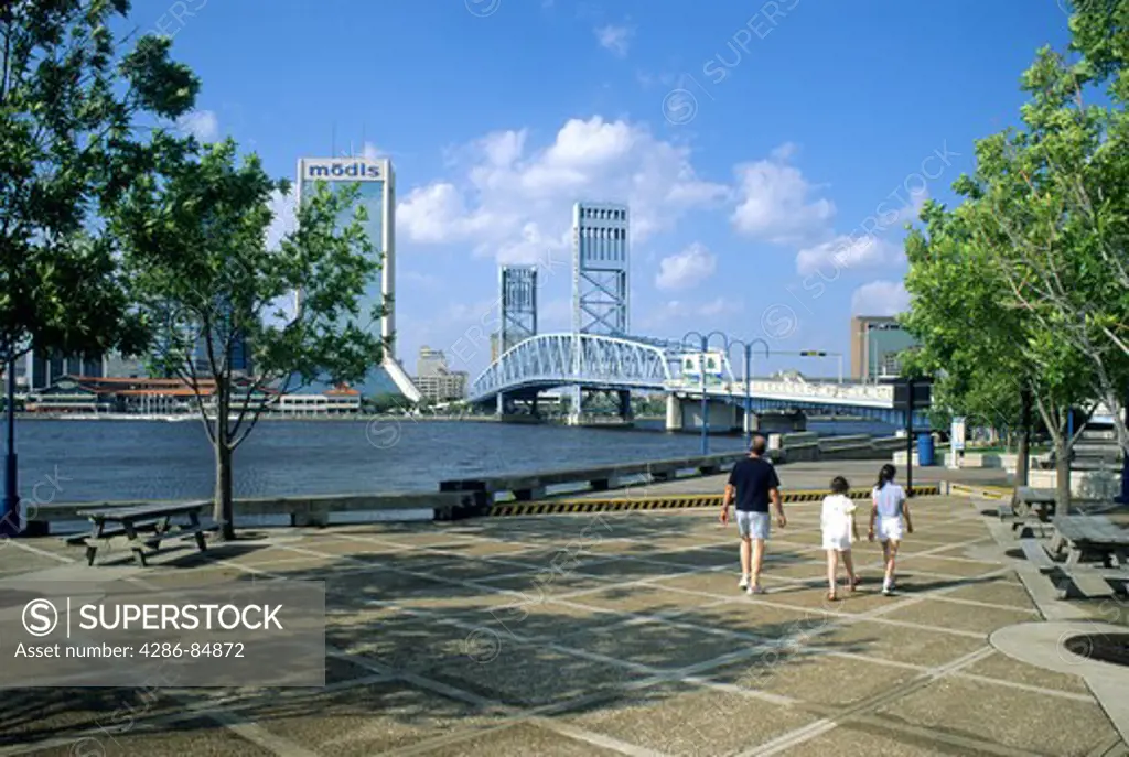 Family walking Riverwalk St. Johns River Jacksonville Florida