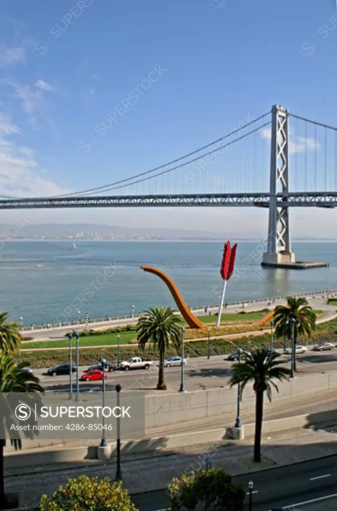 Cupid's Span sculpture on Embarcadero and Bay Bridge San Francisco California