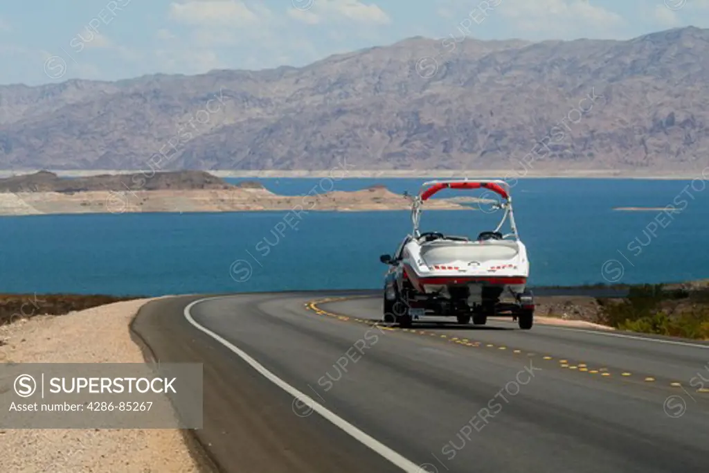 Pickup towing boat trailer on highway at Lake Mead National Recreation near Las Vegas Area Nevada