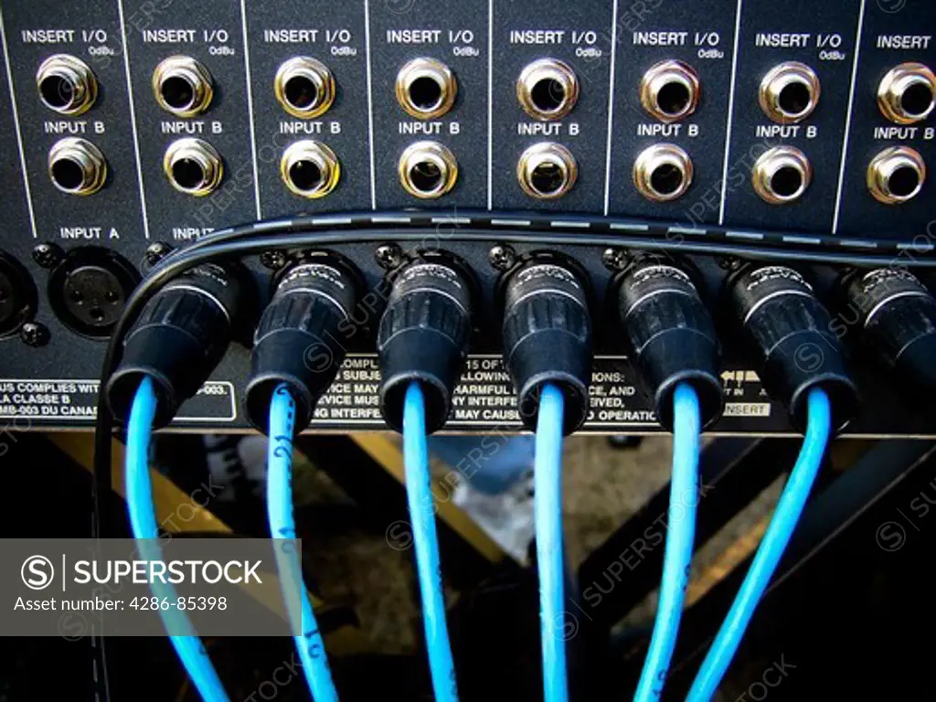 Back connector panel of professional sound control system.