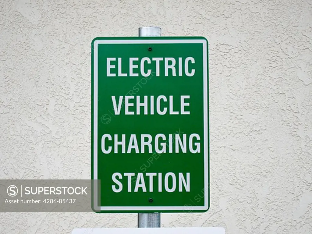 Charging station sign for electric vehicles, bank parking lot, Oxnard, California.