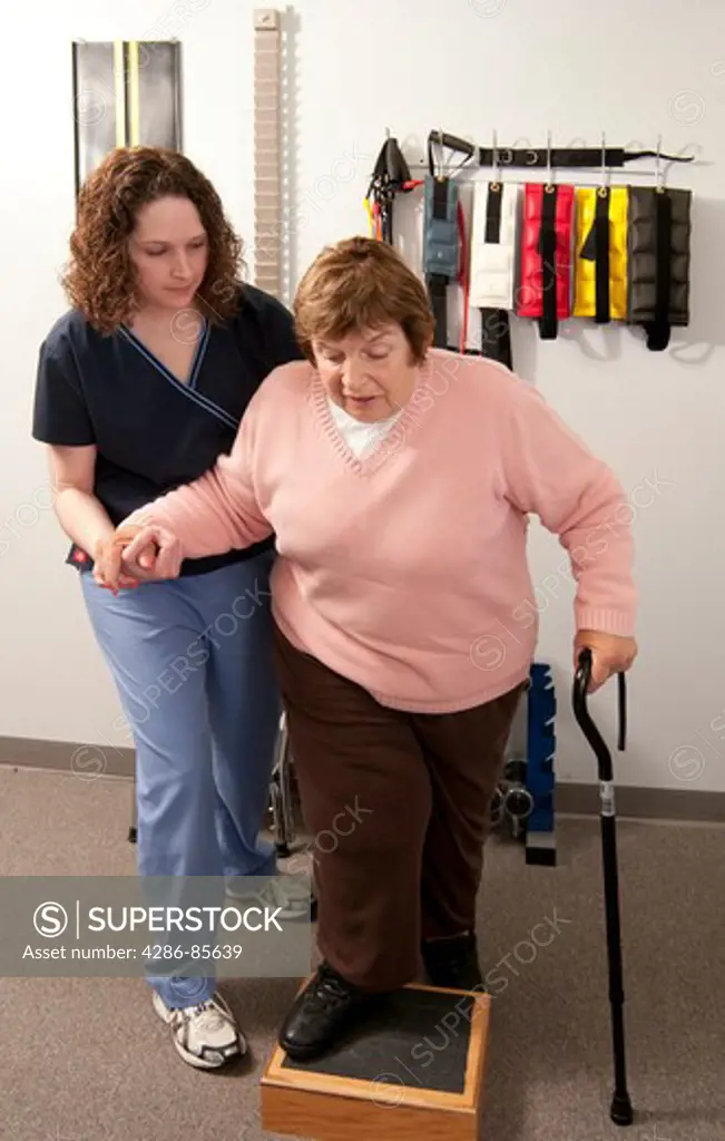 Physical therapist working with an older woman suffering from Lymphedema