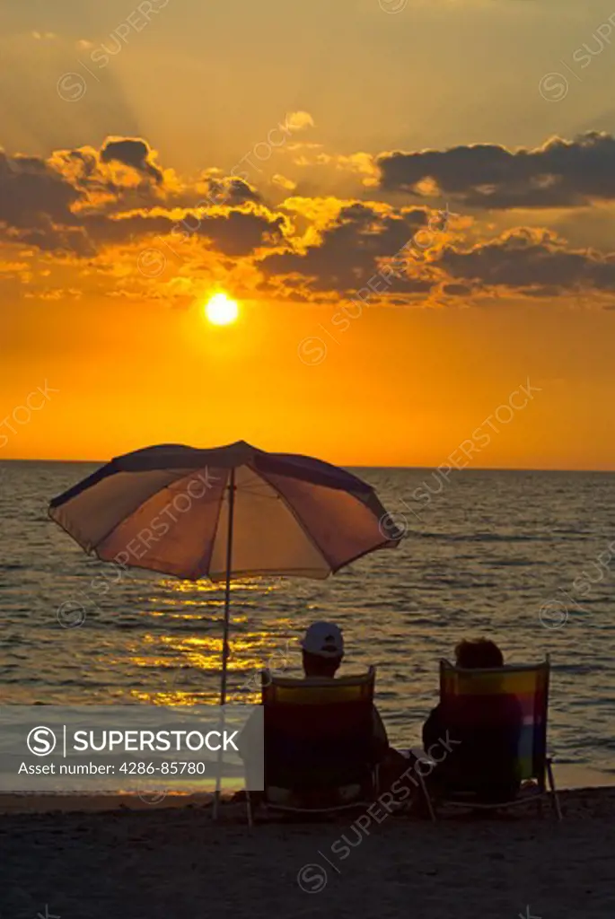 couple relaxing at the beach-sunset-florida west coast-2008