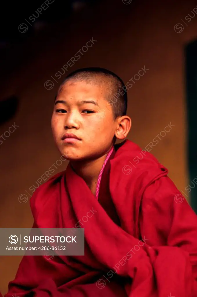 Young buddhist monk in a dzong, Bhutan
