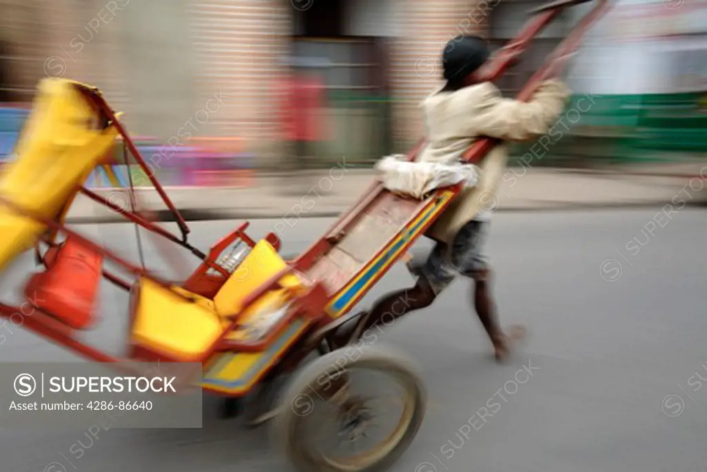 Traditional human powered rickshaw, Ambositra, Madagascar