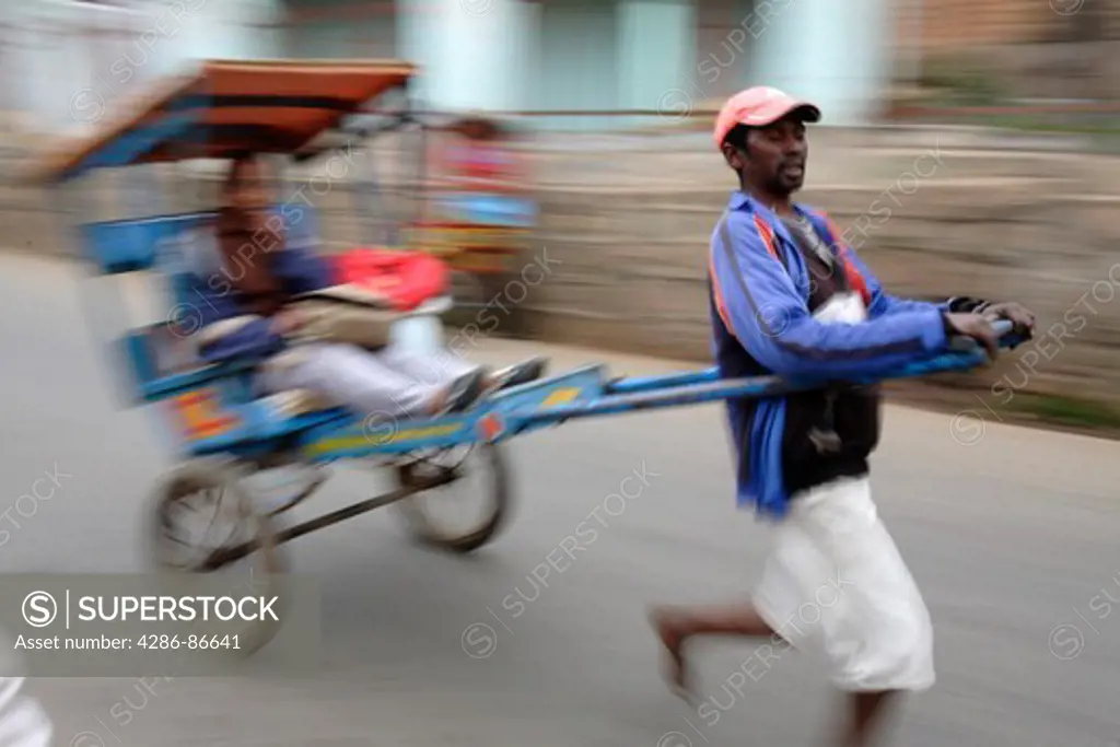 Traditional human powered rickshaw, Ambositra, Madagascar