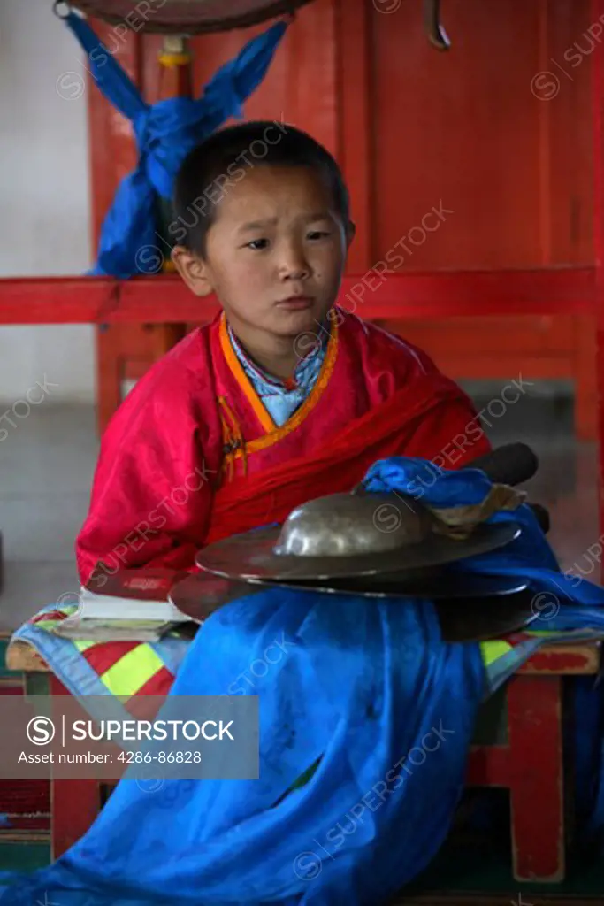 Child monk at reading ceremony, Mongolia