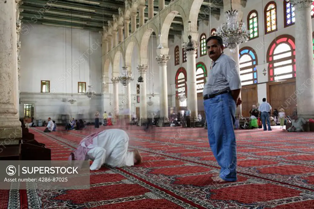 Muslim prayers in the Umayyad mosque, Damascus, Syria