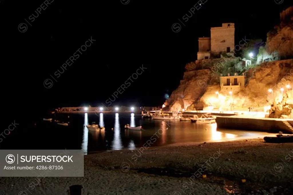 Night shot of the bay of northern Monterosso al Mare with old Convent on the hilltop, Cinque Terre, Italy