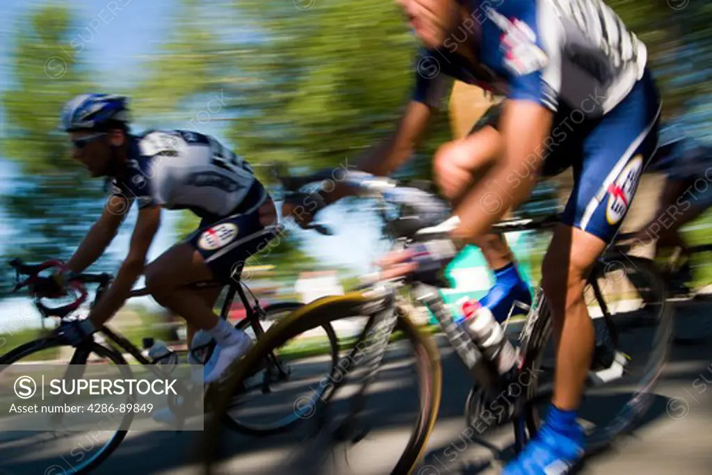 Male athletes competing in a bike criterion race in North Boulder Park in Boulder, Colorado