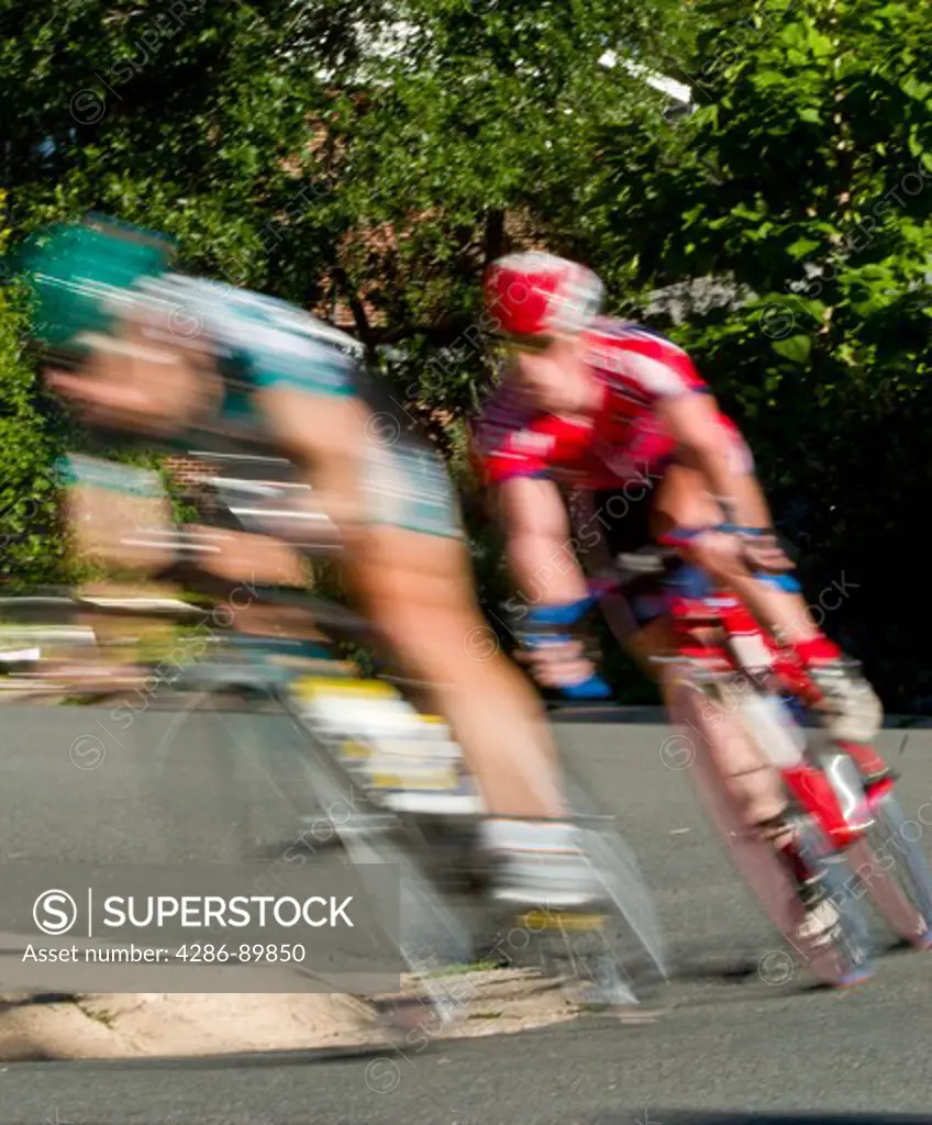 Male athletes competing in a bike criterion race in North Boulder Park in Boulder, Colorado