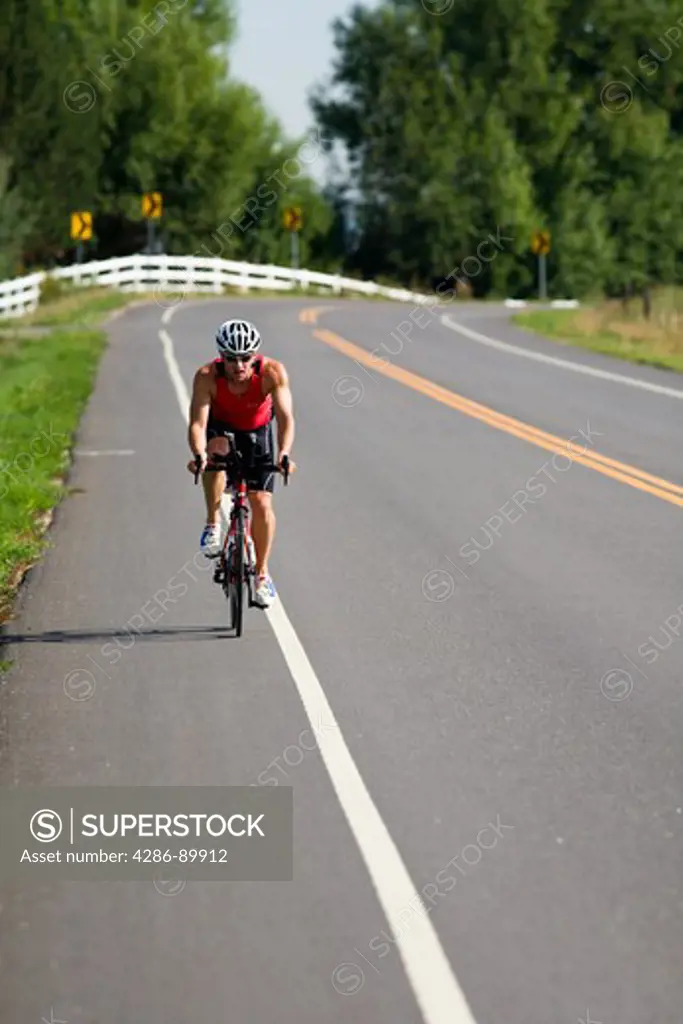 Dmitry Yesilevski trains on his road bike for a triathlon near Boulder, Colorado.