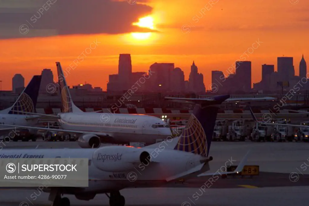 Continental Airlines jets at sunrise, Newark Liberty International Airport - Manhattan skyline is in the distance