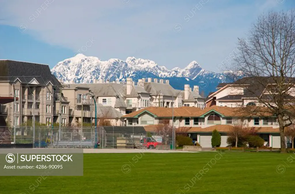 Townhouses and condos with Golden Ears mountains behind, Port Coquitlam, BC, Canada