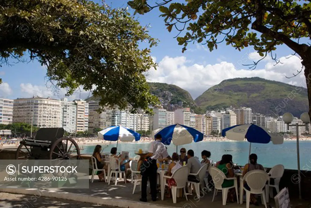 Brazil. Waiter serving drinks to people at the Colombo Cafeteria. Rio Fort (Forte de Copacabana) Rio de Janeiro. 