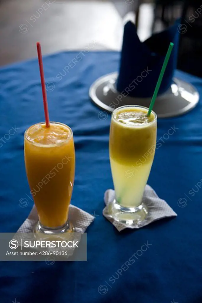 BraziL. Juice drinks at Mercado Modelo Restaurant, Salvador, Bahia. A glass of orange juice (Caja) and Passion Fruit with Pineapple