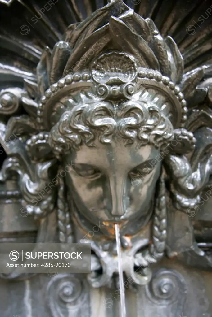 Brazil. Rio de Janeiro, Jardim Botƒnico Gardens. Detail of Bronze face on fountain. The fountain was wrought in England, and it was brought to the park from Lapa in 1905