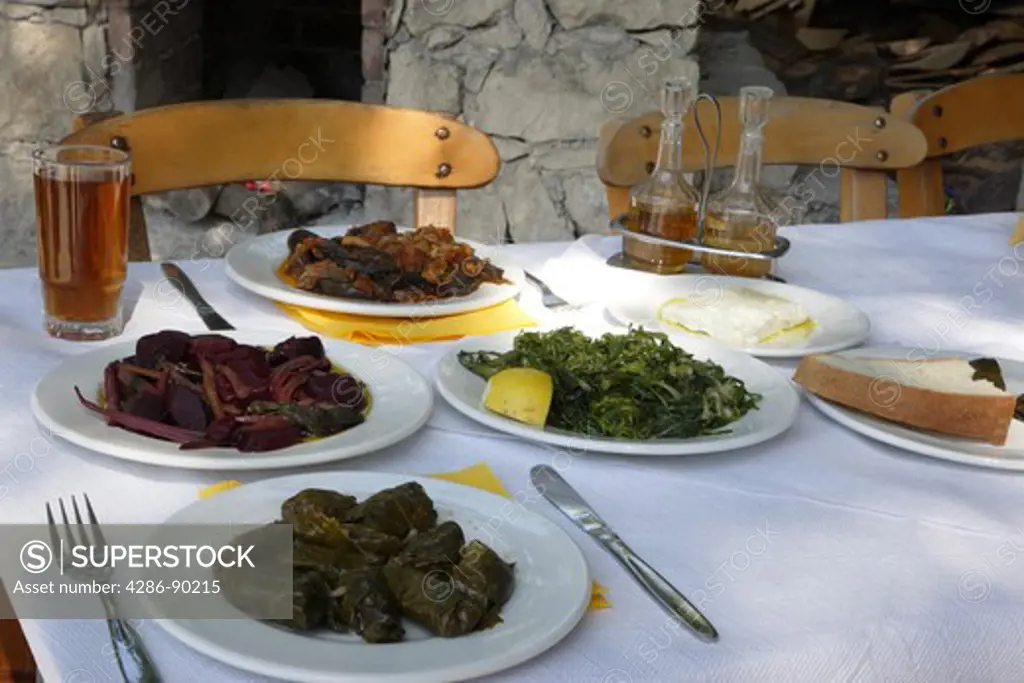 Greek Cuisine. Fresh Dolmades, Beetroot, Eggplants in Tomato sauce, Feta cheese, Vleeta Stamnagathi (Wild Greens)