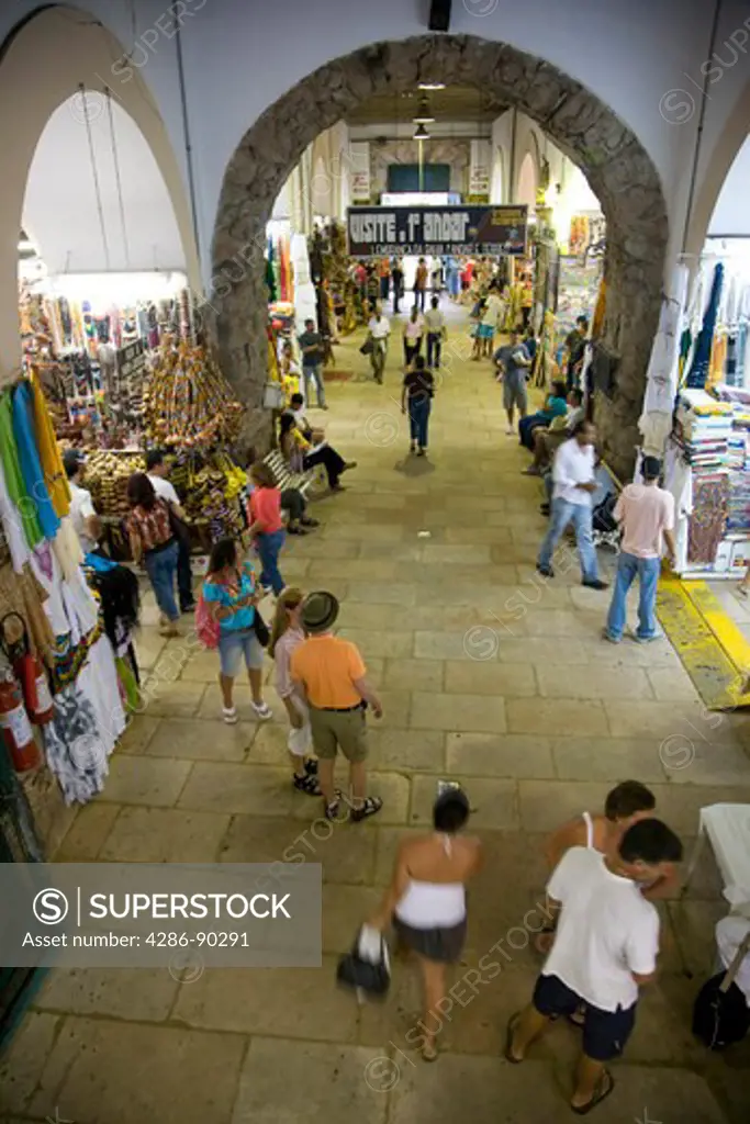 Brazil. Interior of the busy Mercado Modelo Market, Salvador, Bahia. It is the largest handicrafts market in the north-east of Brazil. 