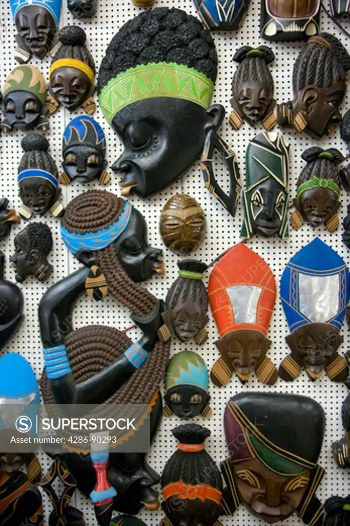 Brazil. Salvador, Bahia. MERCADO MODELO MARKET. Wooden sculptures of black faces