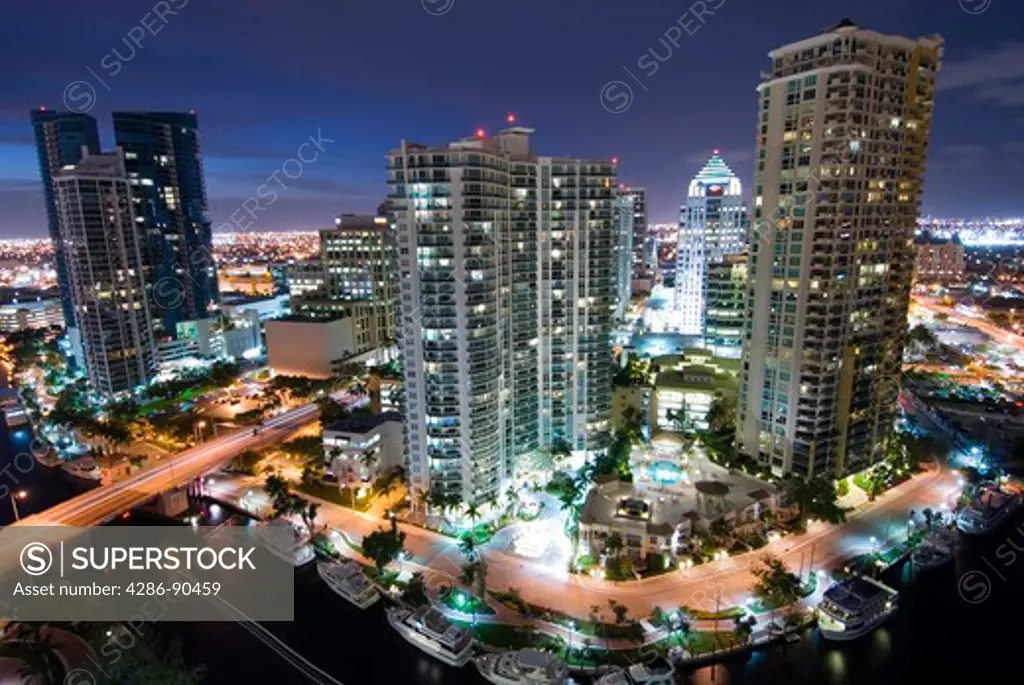 Highrise office towers and condominiums tower over New River in downtown Ft. Lauderdale, FL 